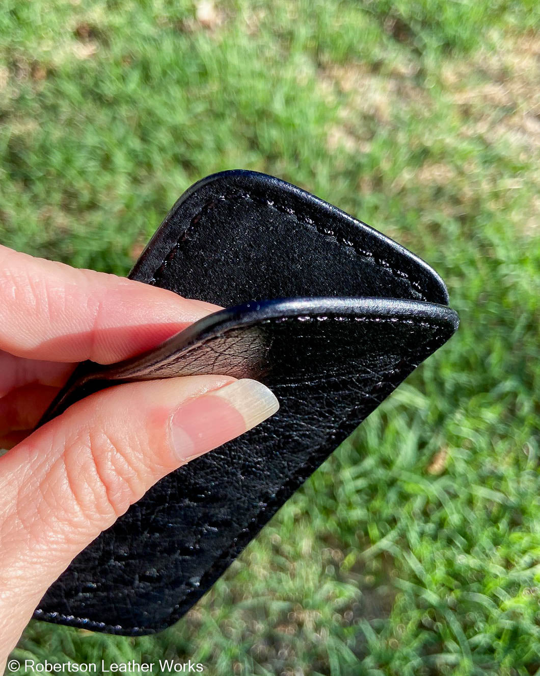 Medium Black Ostrich Leather Knife Slip, Black Stitching